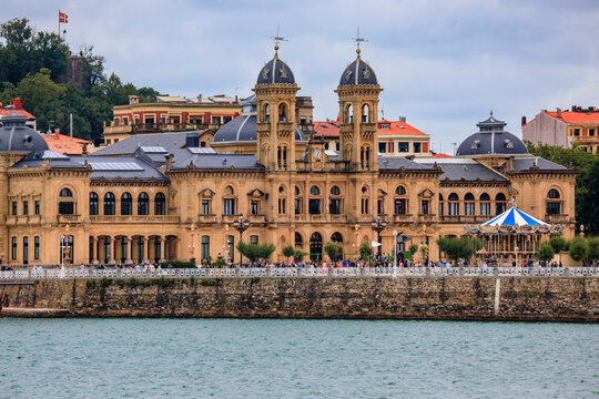 City coastline and Town Hall facade at Alderdi Eder Gardens Park across La Concha bay and beach in San Sebastian Donostia, Basque Country, Spain