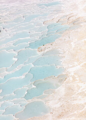 Emerald water in white limestone rock.