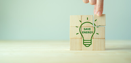 Save energy symblos icon on wooden cubes. Ecology environmentally friendly concept. Net zero...