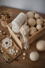 Macrame decor in a wooden box, Christmas ball and stars, handmade, hobby materials.