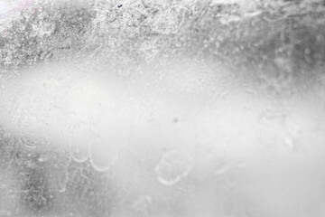 Texture of shabby dirty glass with stains, stains and defects in gray tones
