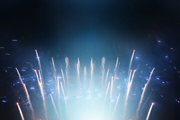 background of abstract black and blue glitter lights with fireworks. defocused