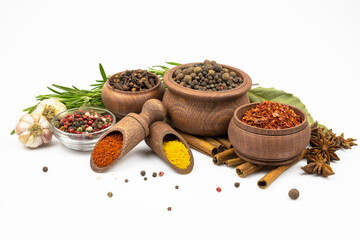 Spices in wooden bowls, garlic  isolated on white background.