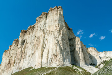 white chalk limestone rock against a blue sky aerial view © Роман Заворотный