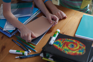 Fototapeta Children preparing for the new school year; new notebooks and school supplies obraz