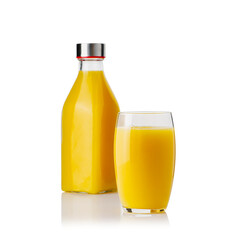 Glass of orange juice and orange juice bottles. Glass and bottle of organic tropical juice