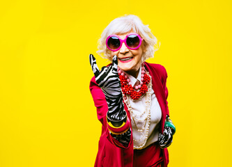 Cool and stylish senior old woman with fashionable clothes - Funny colorful portrait of elderly...