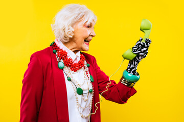 Cool and stylish senior old woman with fashionable clothes - Funny colorful portrait of elderly...