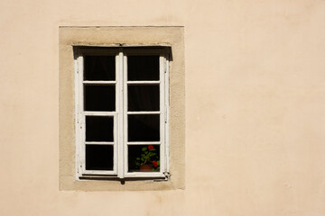 Fototapeta na wymiar Old window on abandoned residentual house close up shot on a sunny day.