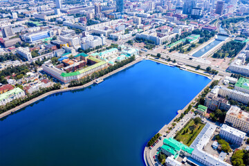 Fototapeta premium Aerial view panorama of modern summer city. Above view of houses and river