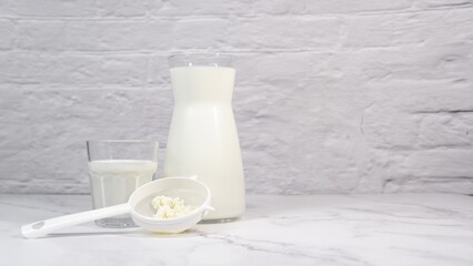 Freshly made kefir with milk jug