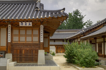 Traditional brown wood Korean architecture temple building complex Gyeongbokgung Palace in Seoul South Korea	