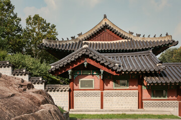 Fototapeta na wymiar Colorful traditional wood Korean architecture temple building at Gyeonghuigung Palace in Seoul South Korea