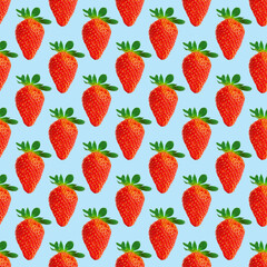 Fresh strawberry seamless pattern. Ripe strawberries isolated on blue. Package design background. Falling strawberry selective focus.