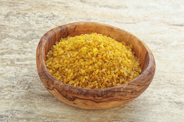 Raw bulgur in the bowl