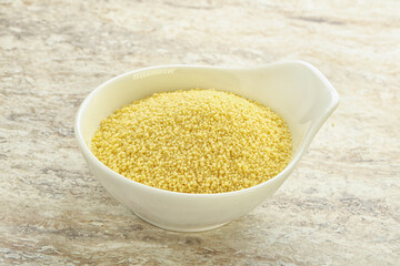 Raw couscous in the bowl