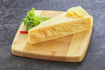 Parmesan cheese piece over board