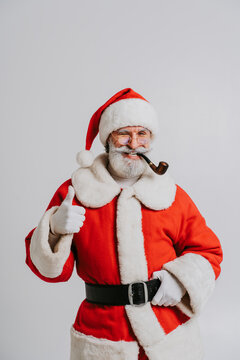 Santa Claus portrait, Christmas and new year's eve festive days concepts - December festive holidays, senior man with beard wearing Santa's costume