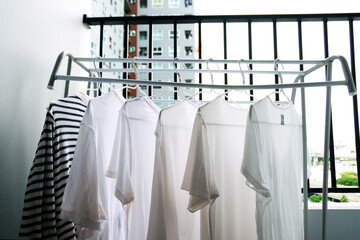 Close up white clothes hang on the clothes rack at the Balcony, White clothes hangers for hanging...