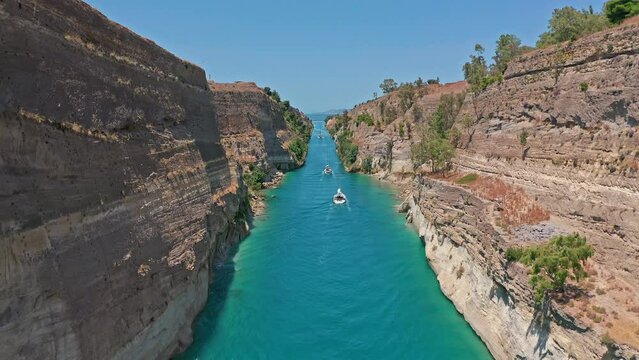 Beautiful Corinth Canal aerial view in Greece. Boats passing sea channel