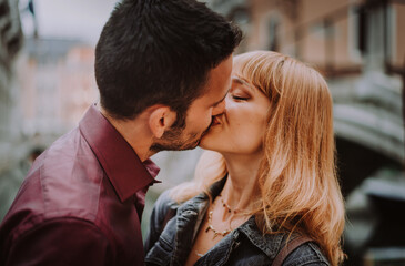 Happy beautiful couple of lovers doing romantic trip in Venice, Italy - Tourists visiting historic town of Venice and St. Mark square