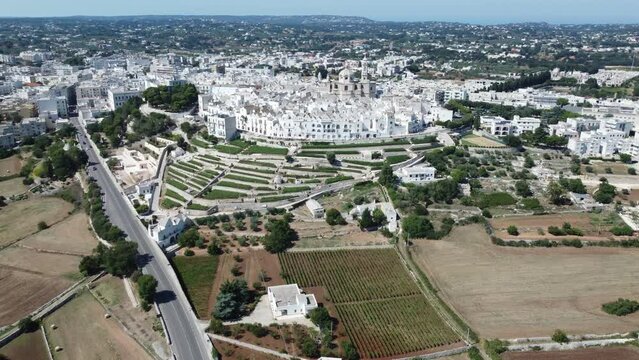 Aerial shot with drone of Locorotondo the white city in the Itria valley, Puglia, southern Italy.