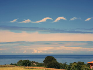 wave-shaped clouds over the Cantabrian Sea, Asturias, Spain,