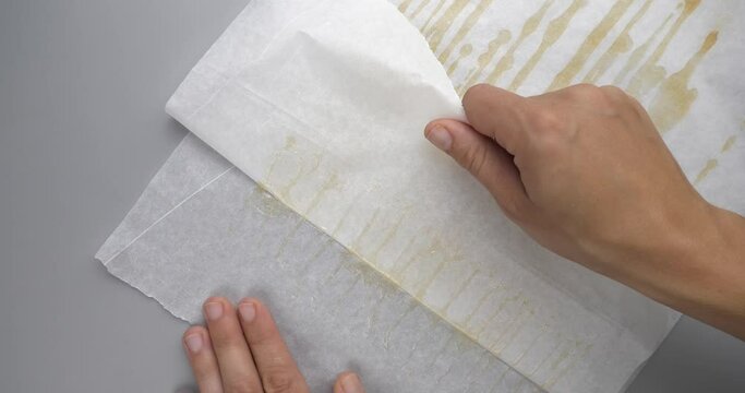 hand cannabis wax glued parchment paper, golden extract of medical marijuana High quality 4k footage