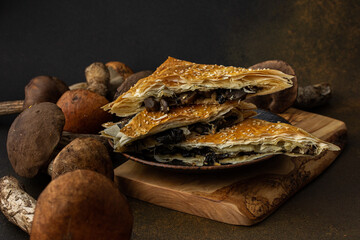 Pie with wild forest mushrooms boletus, phyllo pastry pie with aspen mushrooms