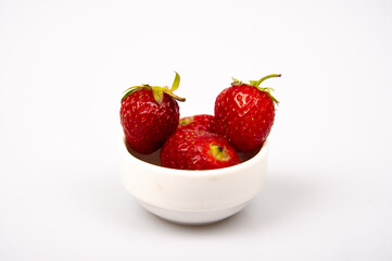 Organic strawberry on white background. Red fresh strawberry.