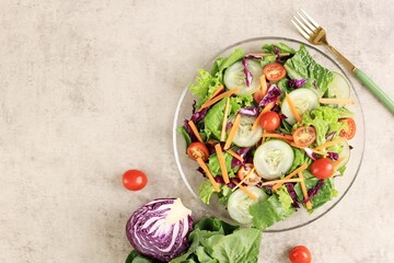 Green Vegetable Salad with Tomato, Purple Cabbage, Carrot, Cucumber, and Lettuce, Top View