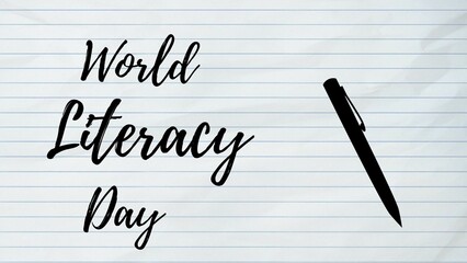 World literacy Day written on a paper with a black pen kept aside. Literacy Day 2023.
