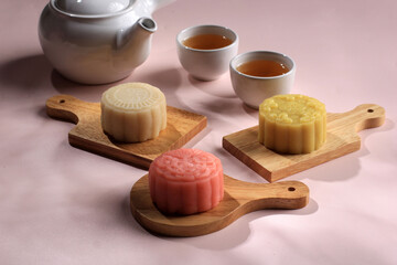 Colorful Snow Skin Moon Cake, Sweet Mochi Mooncake, Traditional Sweet Dessert for Mid Autumn Festival, Served with Tea.