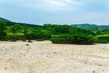Fototapeta na wymiar landscape of Kunashir island, tephra beach of a hot lake at the bottom of Golovnin volcano caldera