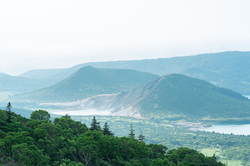 Fototapeta na wymiar natural landscape of Kunashir island, view of the Golovnin volcano caldera with hot lakes