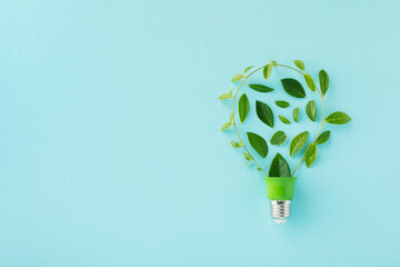 Eco friendly lightbulb from fresh leaves top view. Energy saving, ecology and environment...