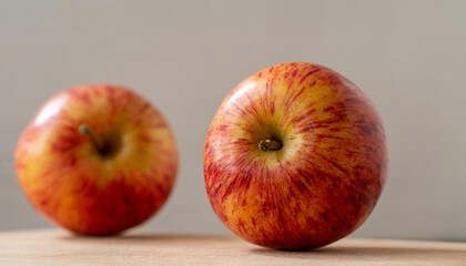 pair of  apple with grey background, close up view, envy apples.
