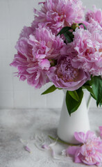 Beautiful bouquet of flowers: white and pink  peonies.