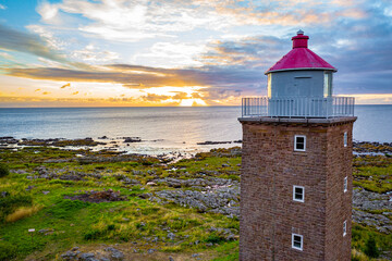 Fototapeta na wymiar closeup aerial view of lighthouse on the coast of the sea on bornholm denmark