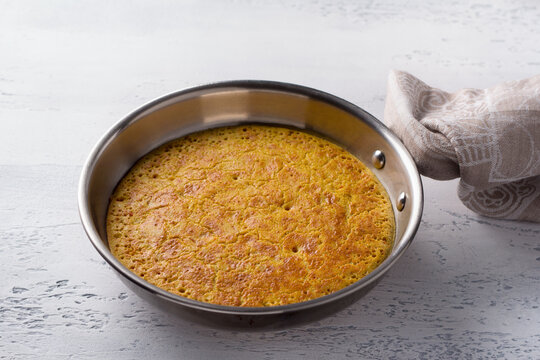 Vegan chickpea omelette in a pan. The concept of delicious homemade vegan food