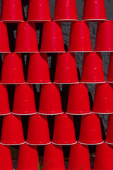 Red plastic cup stacked filling the camera frame