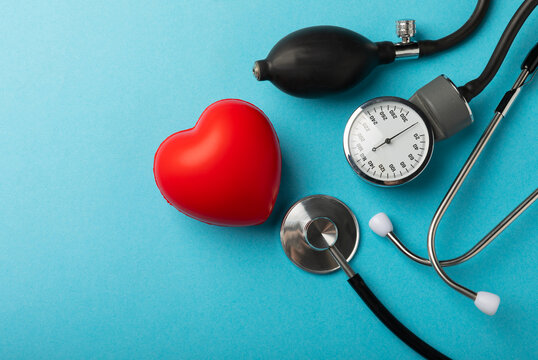 Gray tonometer  on a blue background. Medical equipment blood pressure monitor. Healthcare. Place for text. Medicine concept. The concept of cardiology.