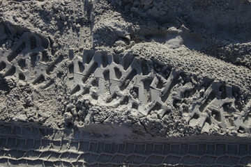car footprint on the beach