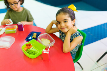 Beautiful cute girl on her lunch break at preschool