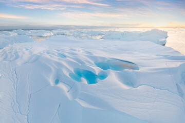 Climate change and global warming. Icebergs from a melting glacier in Greenland. The icy landscape...