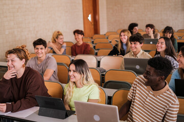 Heterogeneous group of students paying attention to university classes