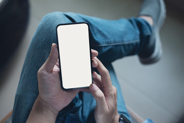 Mockup image of mobile phone for advertising. Mock up image of man hand holding and using smartphone with blank screen for mobile app design or text advertisement