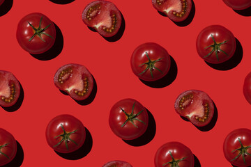 ripe tomatoes on a red background. Vegetables concept