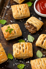 Mini beef patties with vegetables and red wine wrapped in puff pastry