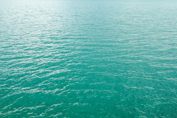 The detail of the surface of the glacier lake with its azure water caused by the calcite and minerals. 